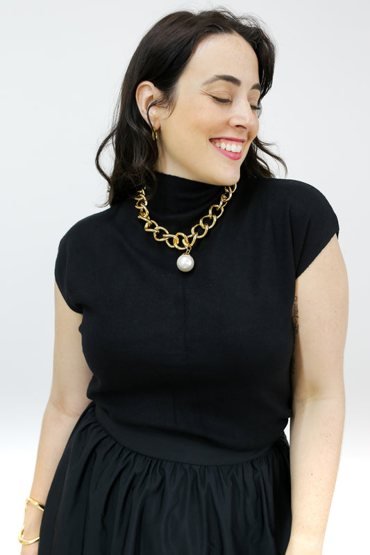 BLUSA RETILINEA GOLA ALTA SEM MANGA
